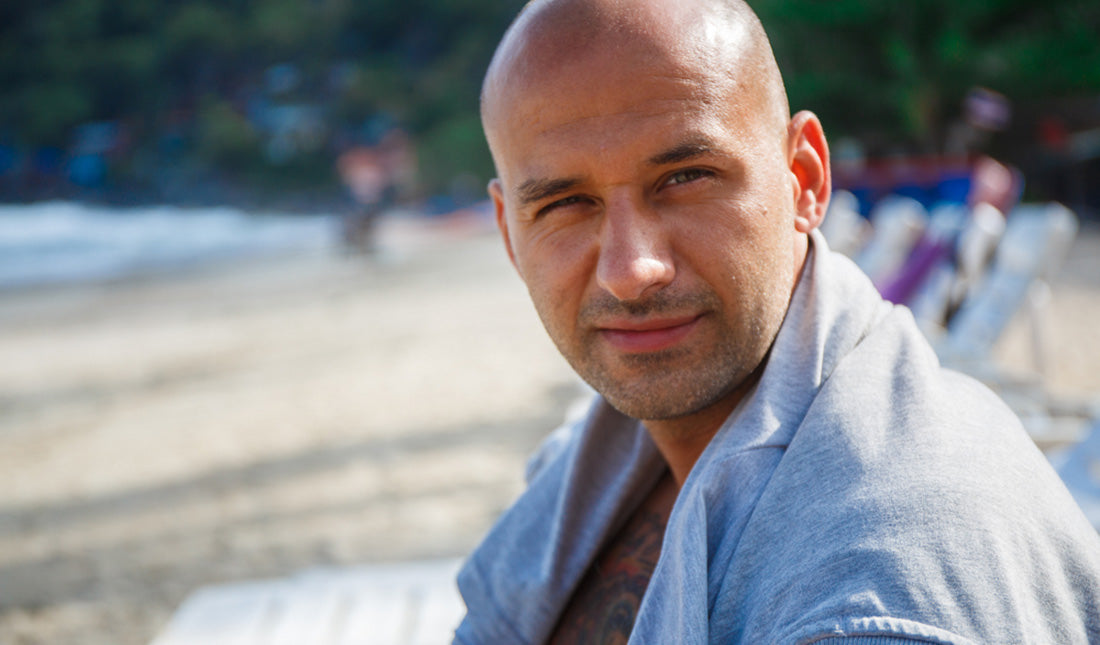 bald man on the beach