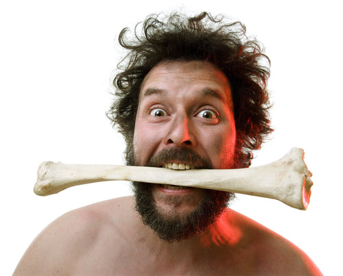 neanderthal with bone in mouth