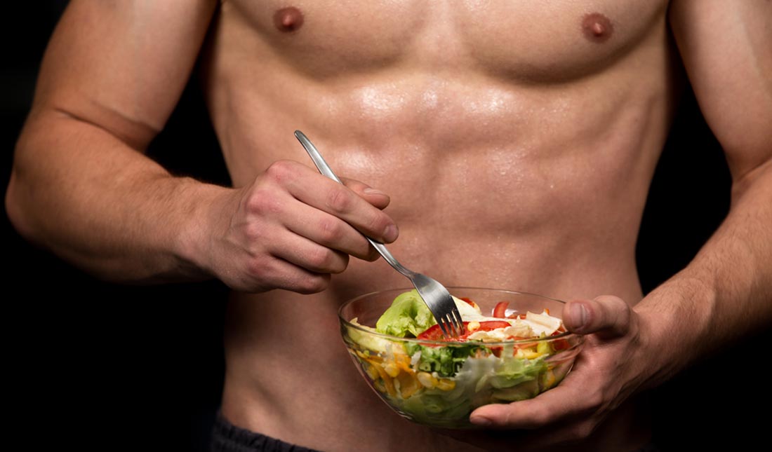 healthy man eating salad