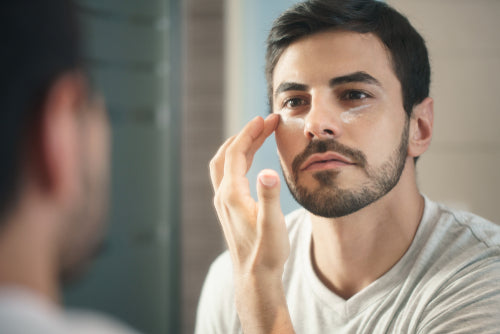 man applying lotion