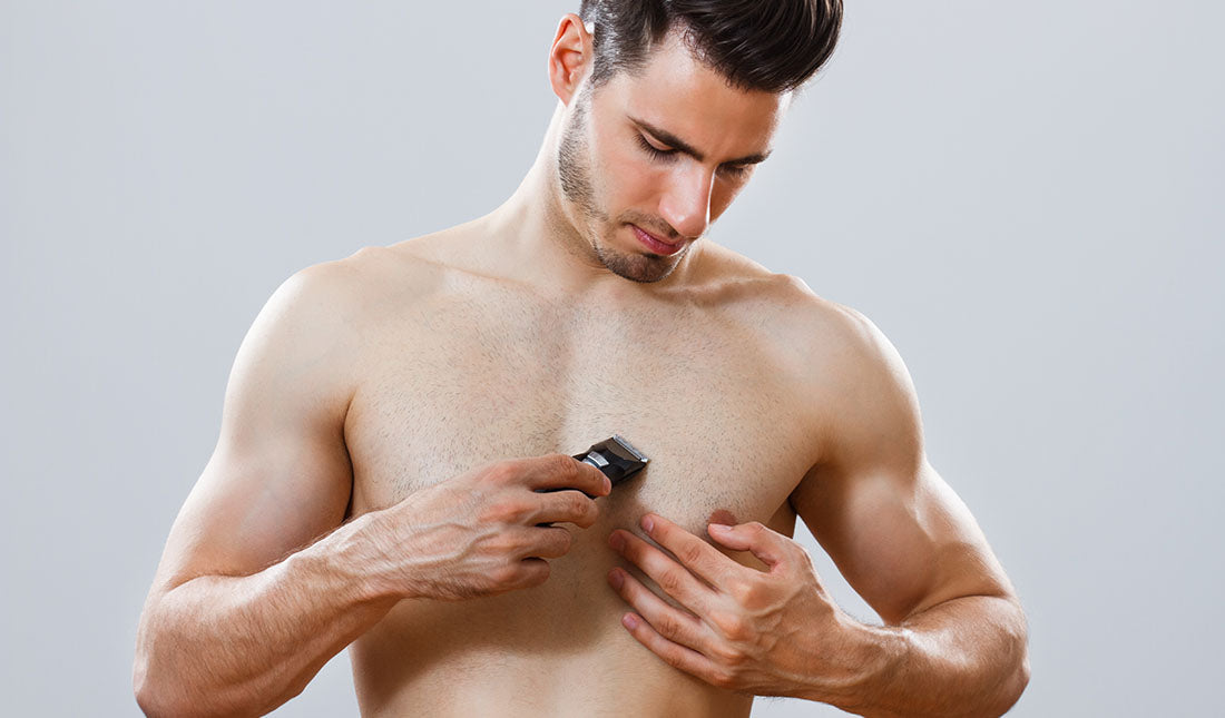 man shaving chest