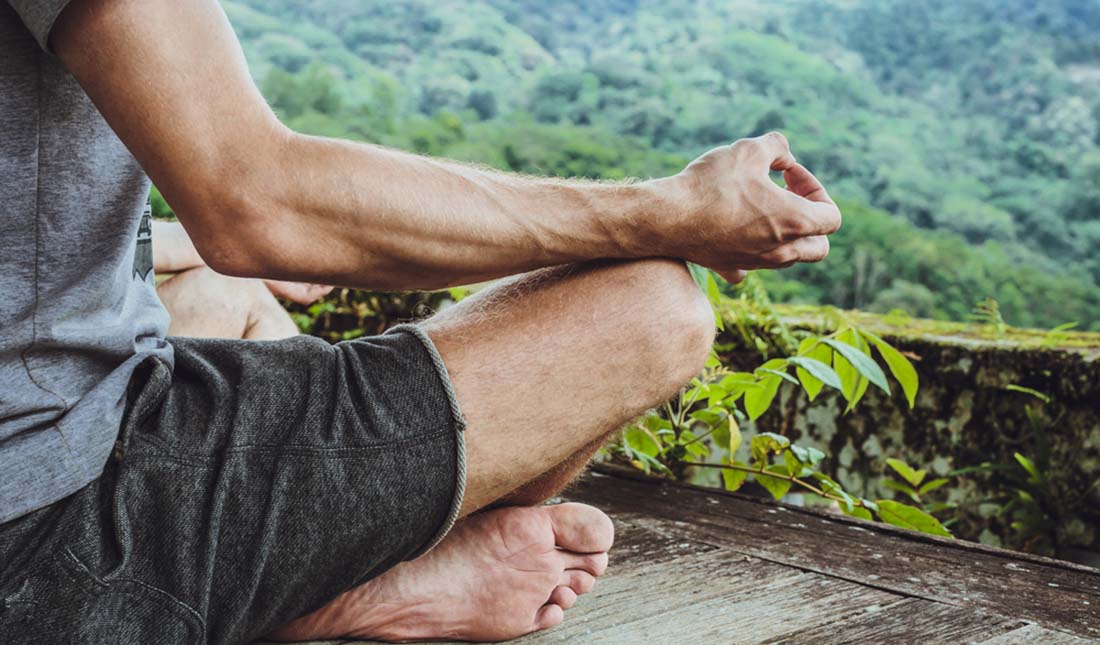 meditating on outdoor deck