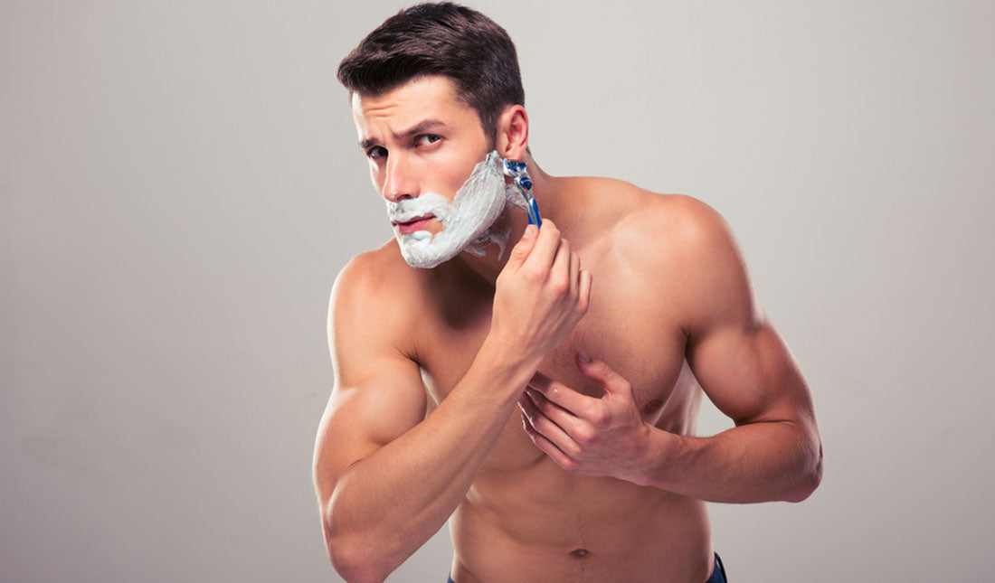 portrait of man shaving face