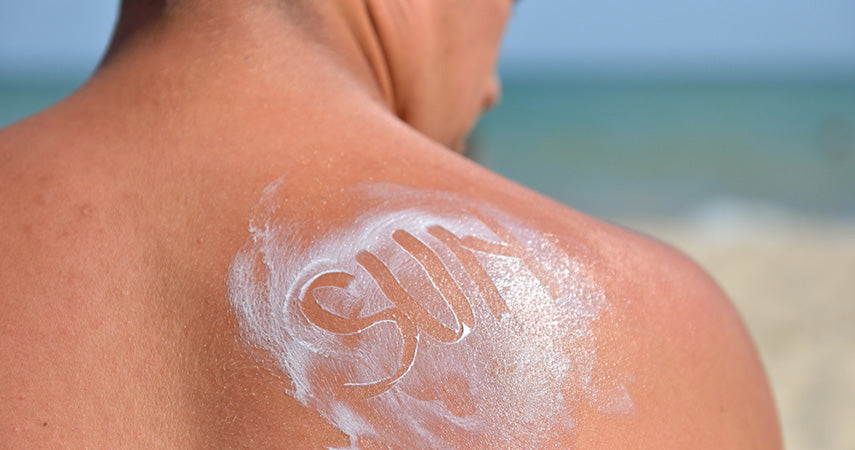 sun written in sunscreen on back